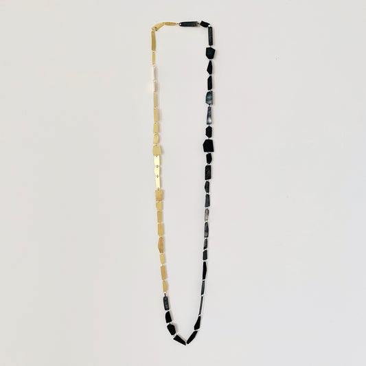 "Hand-sculpted Shards Necklace in 18 kt solid gold with polished edges and matte finish."