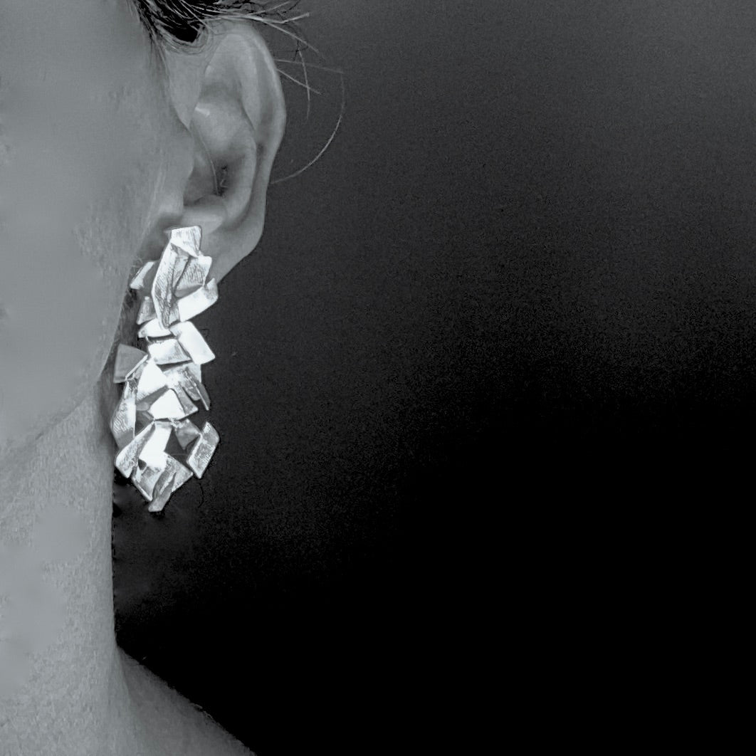 Shard cluster earrings on model.
