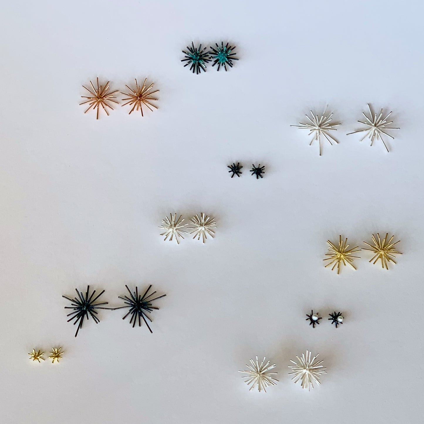 Sea Urchin earrings in solid recycled sterling silver. View the entire collection and choose your favorite pair. These are in the center.
