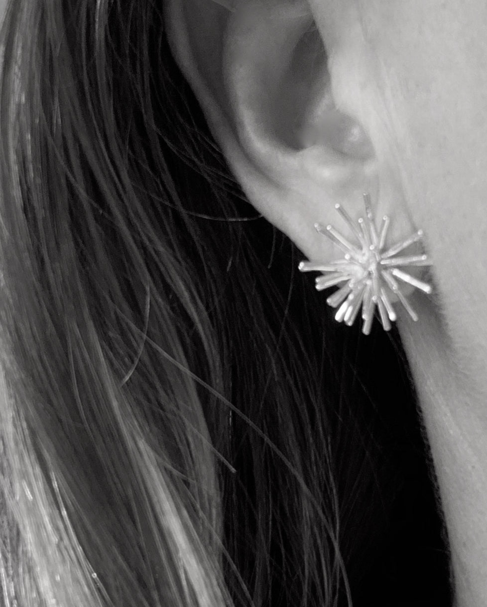 Sea Urchin earrings in solid recycled sterling silver. Model view.