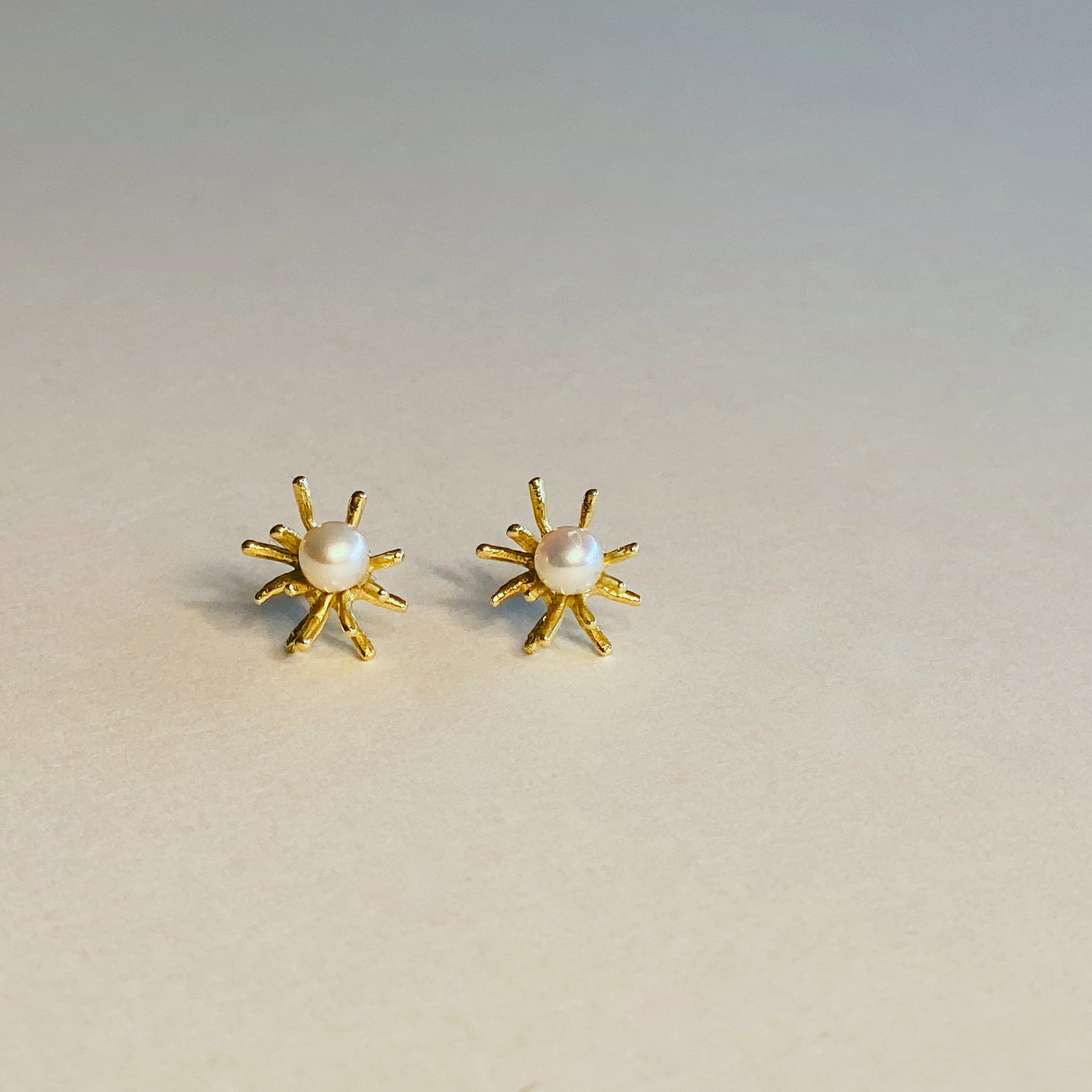 Sea Urchin earrings in solid 18 kt gold with natural pearls.
