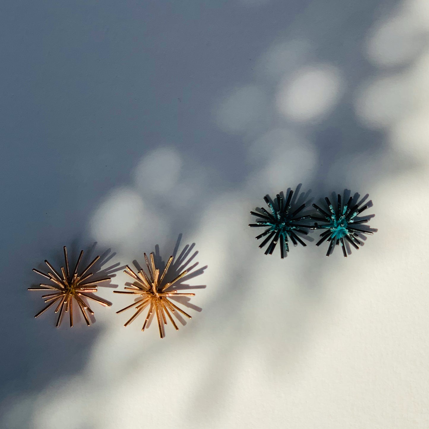 MIW designed these earrings inspired by her underwater explorations. Compare the medium and large size.